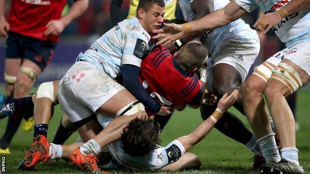 Simon Zebo twists over to score Munster's first try against Racing 92 in Limerick