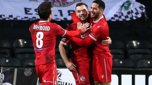 Michael Cheek (centre) has now scored 15 goals for Bromley this season