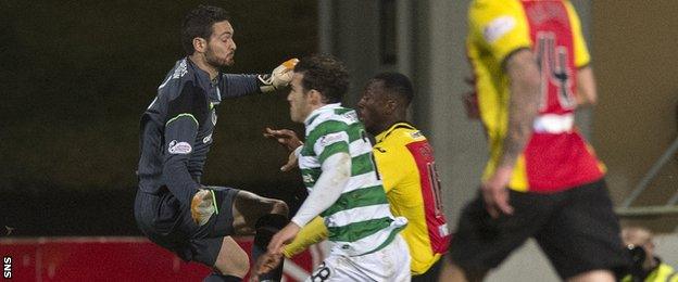 Celtic goalkeeper Craig Gordon challenges Partick Thistle's Ade Azeez