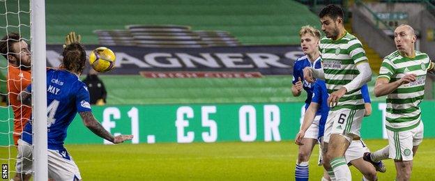 St Johnstone goalkeeper Zander Clark makes a save to deny Celtic's Nir Bitton