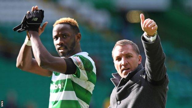 Celtic striker Moussa Dembele has a laugh with manager Brendan Rodgers