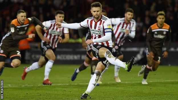 Oliver Norwood of Sheffield United scores a penalty kick