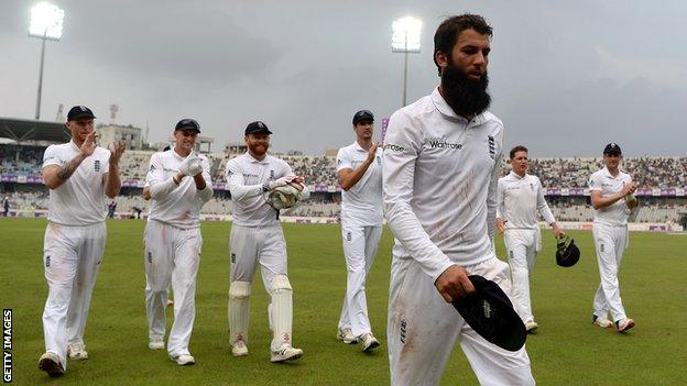 Moeen Ali leads England off the field