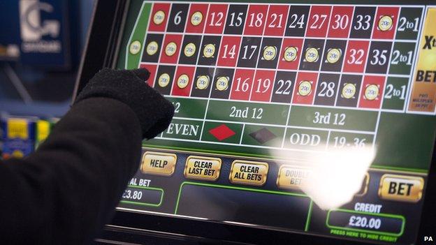 A punter tries out a fixed-odds betting terminal