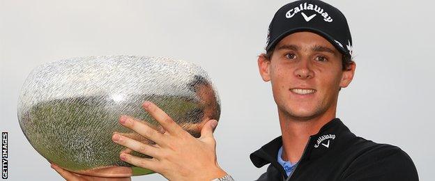 Thomas Pieters of Belgium poses with the trophy following his victory during the final round of Made in Denmark at Himmerland, Denmark