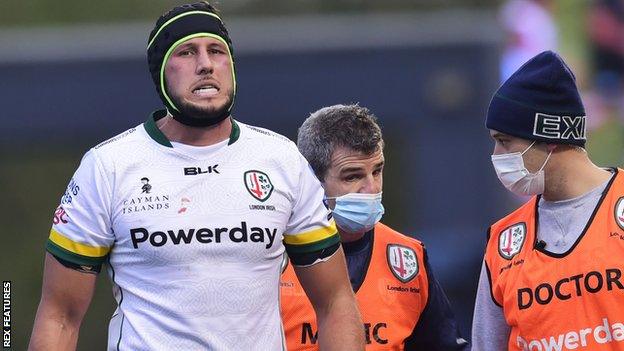 London Irish's Adam Coleman comes off the field against Saracens