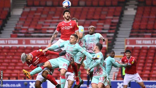 Tobias Figueiredo rises highest to win a header