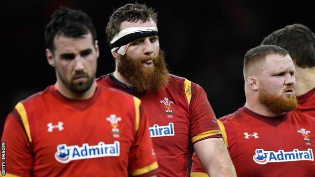 Welsh players including Jake Ball leave the field after defeat against England