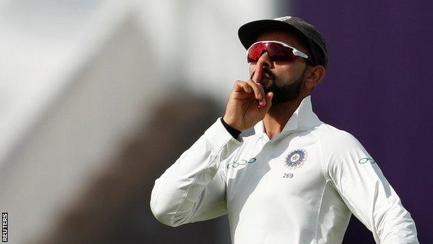 Virat Kohli celebrates running out Joe Root