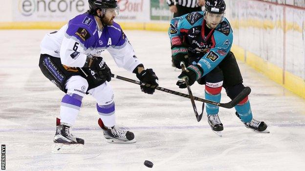 Mark Garside battles with Scott Aarssen in Saturday's game at the SSE Arena