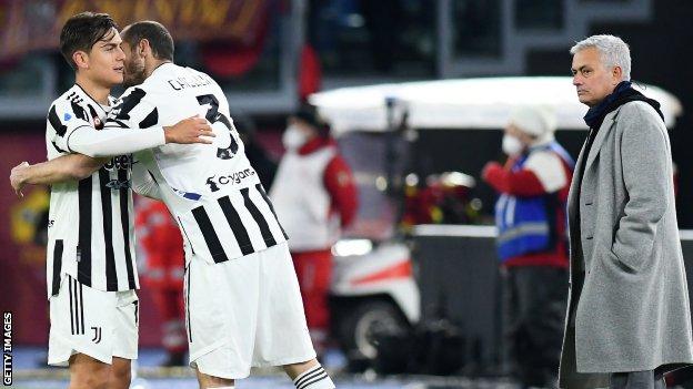 Juventus players Paulo Dybala and Giorgio Chiellini celebrate in front of Jose Mourinho during Roma's recent 4-3 home defeat in Serie A