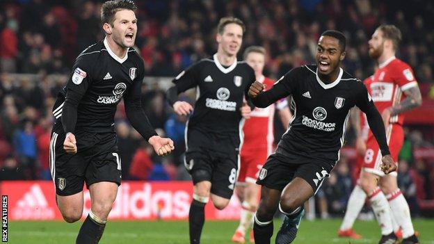 Fulham midfielder Oliver Norwood celebrates scoring his late penalty with Ryan Sessegnon