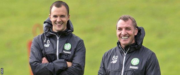 Celtic assistant Chris Davies and manager Brendan Rodgers look happy in training