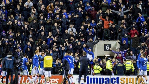 Rangers fans and players celebrate beating Hibernian