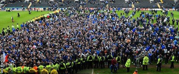 Pompey fans on pitch