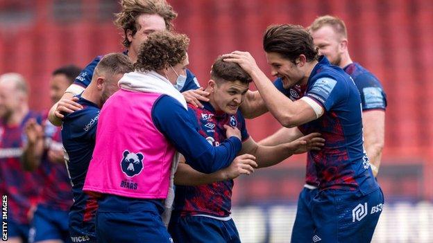 Callum Sheedy is congratulated by team mates