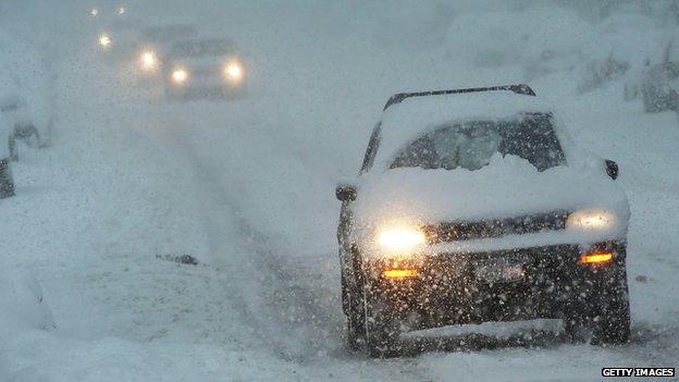 Cars driving in snowstorm