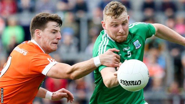 Armagh's Niall Grimley and Fermanagh's Aidan Breen