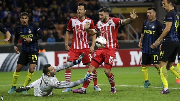 Inter keeper Samir Handanovic saves from Charlie Austin