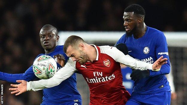 N'Golo Kante (left) and Tiemoue Bakayoko (right) tackle Jack Wilshere