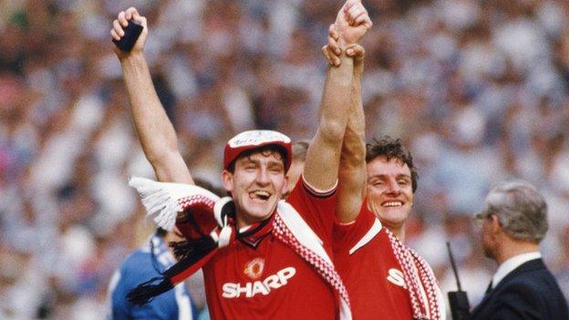 Norman Whiteside celebrates winning the 1985 FA Cup final along with United team-mate Kevin Moran