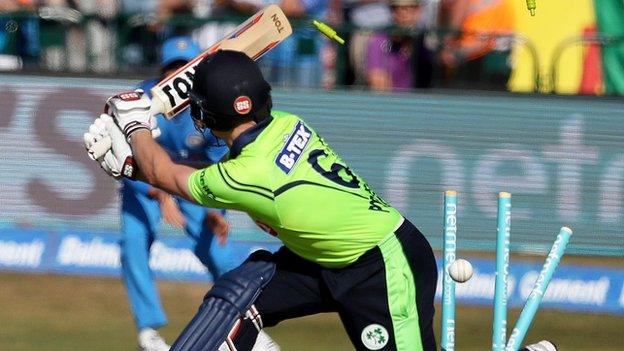 William Porterfield can only watch on after he is bowled by Umesh Yadav at a sun-bathed Malahide