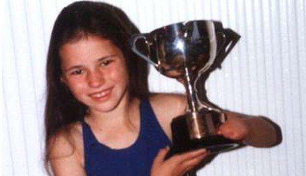 Dame Sarah Storey aged 10 with a swiming trophy