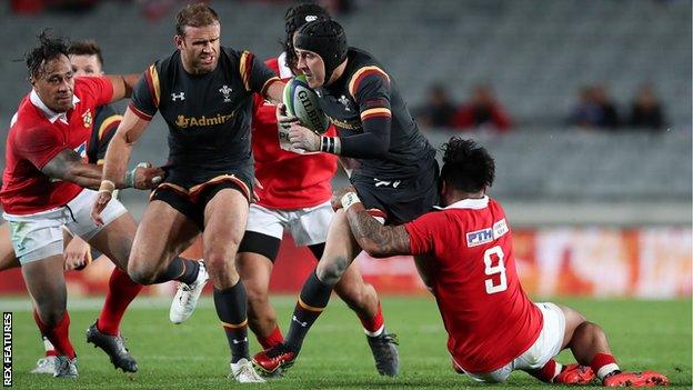 Wales fly-half Sam Davies makes a break against Tonga with Jamie Roberts in support