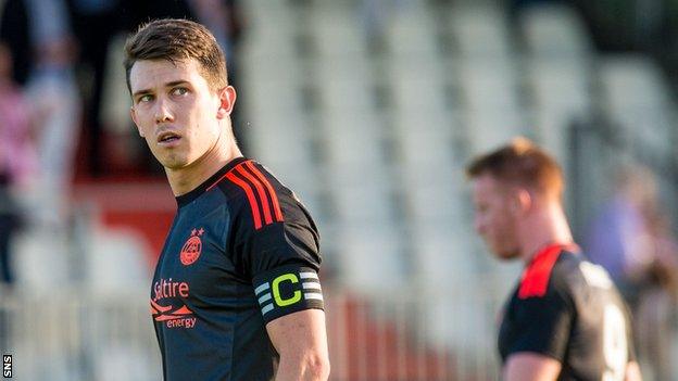 Aberdeen captain Ryan Jack and Adam Rooney leave the field at full-time