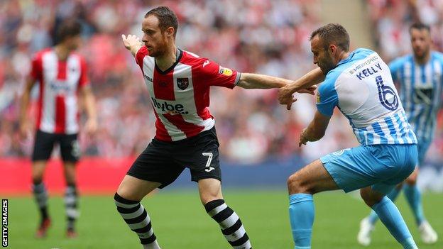 Ryan Harley playing for Exeter City