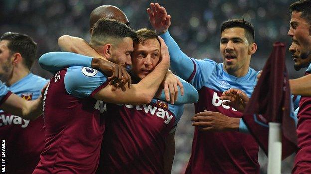 West Ham players celebrate Mark Noble's second goal