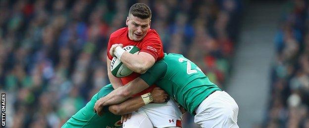 Scott Williams of Wales is tackled by Fergus McFadden