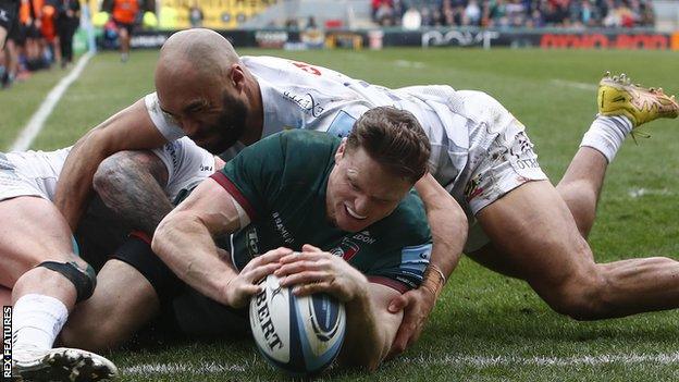 Chris Ashton attempts to touch down as he is tackled by Stuart Hogg and Olly Woodburn