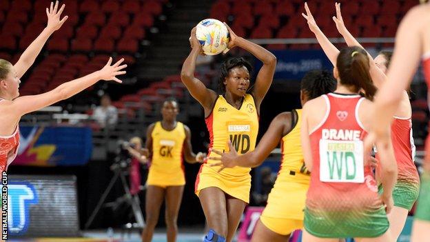 Suzy Drane marshalls the Wales defence to repel another Uganda attack