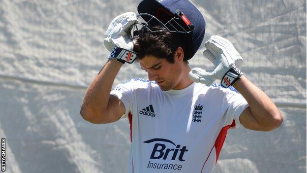 Alastair Cook dons a helmet