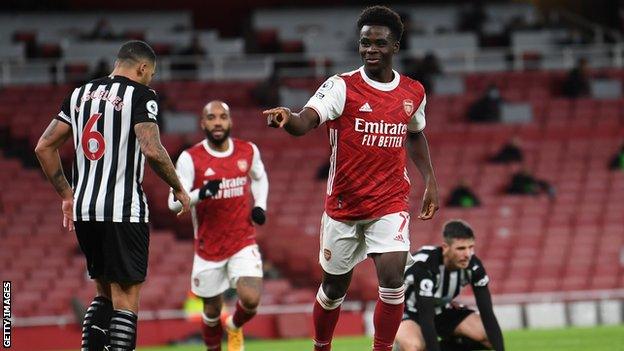 Bukayo Saka celebrates after scoring against Newcastle