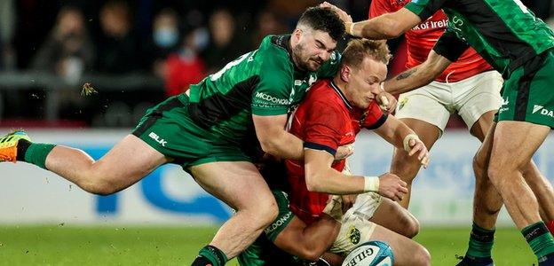 Connacht and Munster vie for possession in their inter-provincial derby at Thomond Park