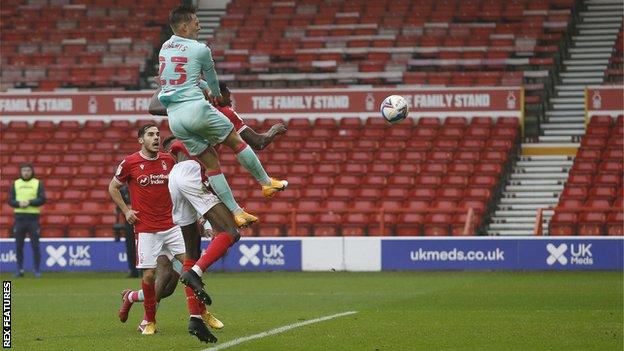 Connor Roberts rises high to head home his first goal of the season