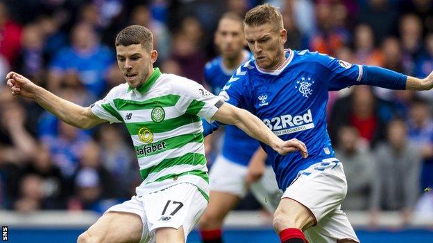 Celtic's Ryan Christie (left) holds off Rangers' Steven Davis during September's Old Firm clash