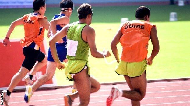 Visually-impaired runners with guide runners