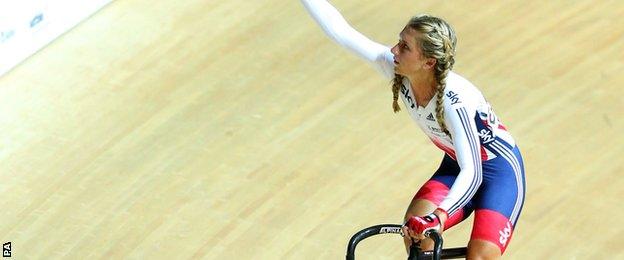 Laura Trott celebrates after winning the omnium