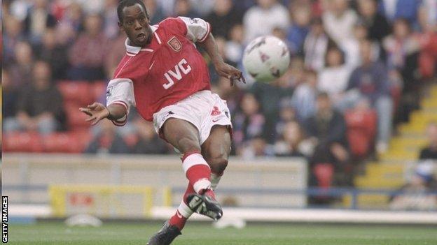 Ian Wright curls home a shot for Arsenal