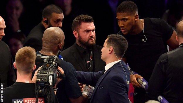 Joshua and Whyte - who fought in 2015 - exchanged words over the ring ropes in London