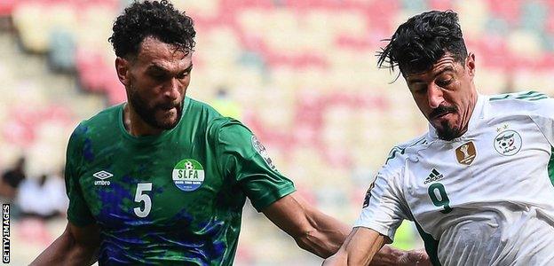 Steven Caulker in action for Sierra Leone against Algeria striker Baghdad Bounedjah