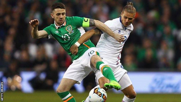 Robbie Brady battles with Iceland's Rurik Gislason