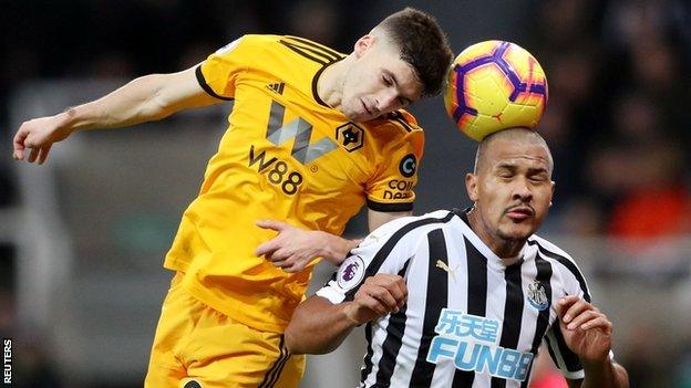 Ruben Vinagre heads the ball away from Salomon Rondon