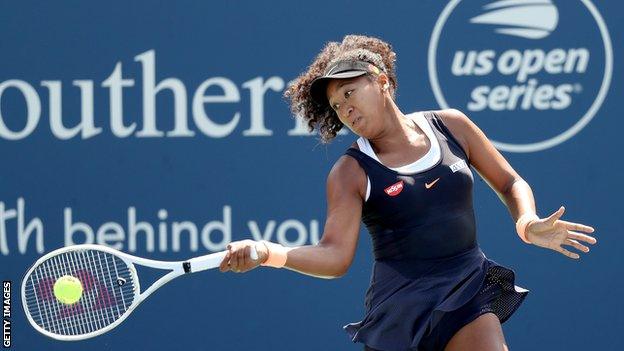 Naomi Osaka hitting a return at the Western and Southern Open