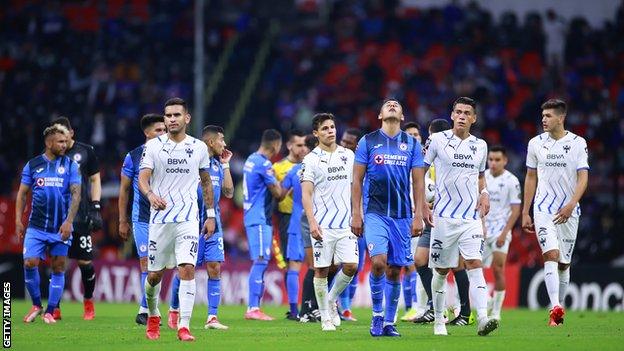 Cruz Azul and Monterrey players leave pitch