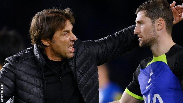 Tottenham manager Antonio Conte congratulates Ben Davies after their win at Brighton