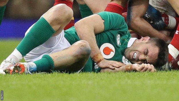 Conor Murray feels the pain after going down injured at the Principality Stadium